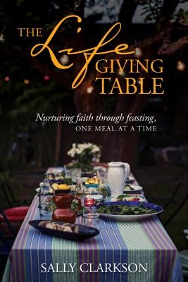 Paperback of The Lifegiving Table by Tyndale Momentum, featuring a cozy dining scene with a family sharing a meal.