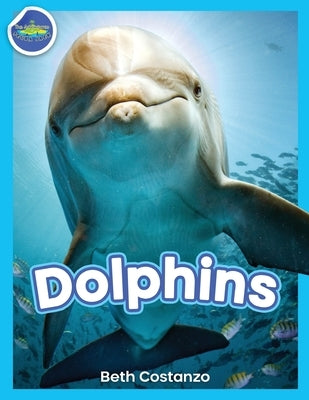 Paperback book titled "Dolphins!" from Adventures of Scuba Jack, featuring colorful dolphin illustrations on the cover.