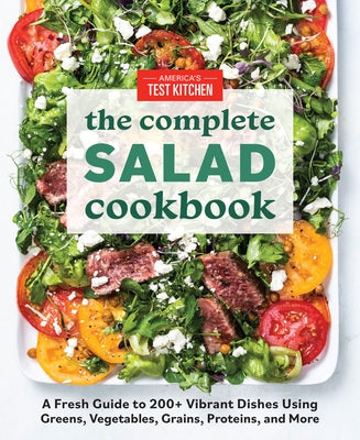 Paperback salad cookbook by America's Test Kitchen showing colorful salad dishes and vibrant greens on the cover.