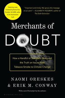 Paperback of Merchants of Doubt by Bloomsbury Publishing, featuring the book cover with title and author details.