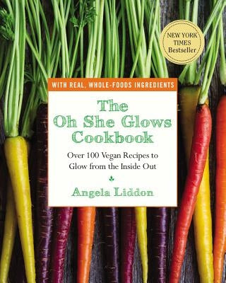 Paperback of The Oh She Glows Cookbook by Avery Publishing Group, featuring vibrant vegan recipes on the cover.