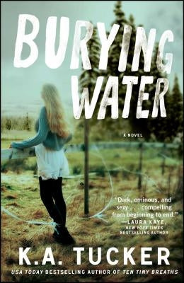 Paperback copy of "Burying Water" by Atria Books, featuring the book's cover with title and author details.
