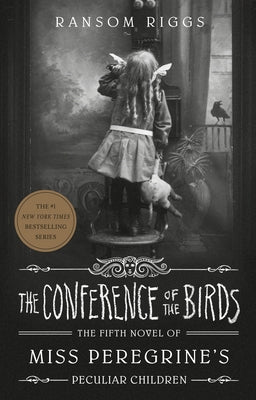 Paperback of "The Conference of the Birds" by Penguin Books, showing the book cover with colorful bird illustrations.