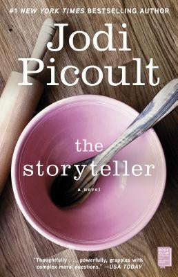 Paperback of The Storyteller book by Atria Books, showing the front cover with title and author details.