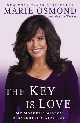 Paperback book titled "The Key Is Love: My Mother's Wisdom, A Daughter's Gratitude" by Penguin Publishing Group, with a soft cover and title visible.