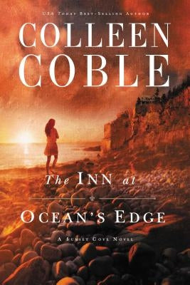 Paperback copy of "The Inn at Ocean's Edge" by Thomas Nelson, featuring a cover with ocean and inn imagery.