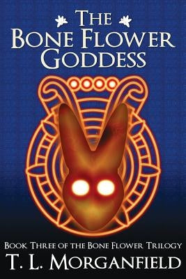 Paperback of The Bone Flower Goddess from Feathered Serpent Books, featuring the book cover with intricate artwork.