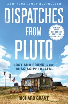 Paperback of "Dispatches from Pluto" by Simon & Schuster, showing the book cover with title and author details.