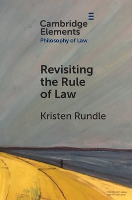 Paperback copy of "Revisiting the Rule of Law" by Cambridge University Press, showing the book cover with title and publisher logo.