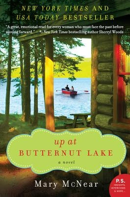 Paperback copy of "Up at Butternut Lake" novel by William Morrow & Company featuring a serene lakeside scene on the cover.