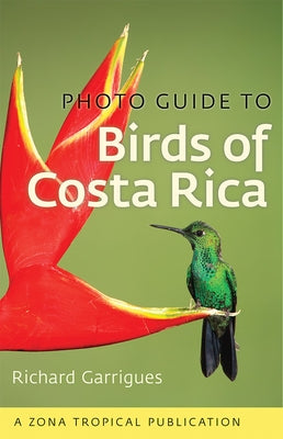 Open bird guide showing colorful Costa Rican birds with detailed illustrations from the Comstock Publishing "Photo Guide to Birds of Costa Rica"