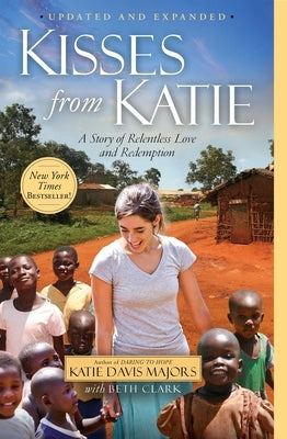 Paperback of Kisses from Katie book by Howard Books featuring a cover with a photo of Katie in a compassionate pose.