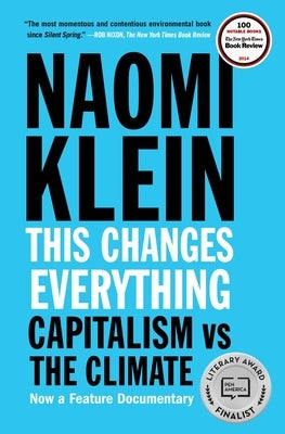 Paperback book titled "This Changes Everything: Capitalism vs. the Climate" by Simon & Schuster with a cover image showing the title and design.