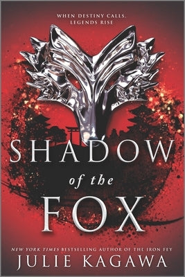 Paperback copy of Shadow of the Fox by Inkyard Press, featuring the book cover with vibrant artwork and title text.