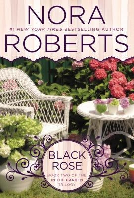 Paperback copy of Black Rose novel by Berkley Books, featuring a dark floral cover design.