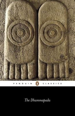 Paperback copy of The Dhammapada by Penguin Group, showing the front cover with traditional Asian artwork and title text.