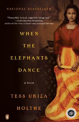 Paperback copy of "When the Elephants Dance" by Penguin Books, featuring the book cover with elephants illustration.