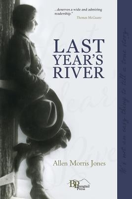 Paperback copy of Last Year's River by Bangtail Press, featuring the book cover with scenic river imagery.