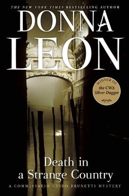 Paperback of "Death in a Strange Country" by Grove Press, showing the book cover with title and author details.
