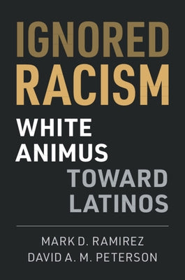 Paperback book titled "Ignored Racism" by Cambridge University Press, featuring a cover with diverse community imagery.