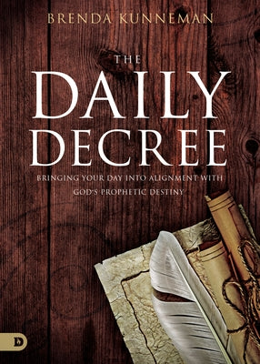 Paperback copy of The Daily Decree book by Destiny Image Incorporated, featuring a spiritual guide for aligning your day with God's prophetic destiny.
