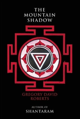 Cover of Grove Press's paperback novel The Mountain Shadow featuring a mountain landscape and shadowy design.