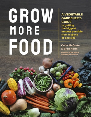 Paperback book titled "Grow More Food: A Vegetable Gardener's Guide" by Storey Publishing, featuring a vibrant vegetable garden on the cover.