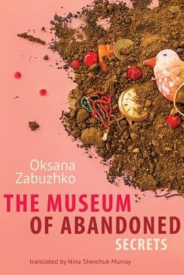 Paperback of The Museum of Abandoned Secrets by Amazon Crossing, featuring a cover with mysterious, abandoned building imagery.