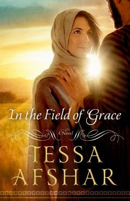 Paperback copy of "In the Field of Grace" by Moody Publishers, featuring a cover with serene artwork and book title text.