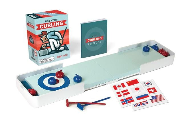 Paperback copy of "Hurry Hard!" desktop curling game by Rp Minis, featuring a curling-themed cover design.