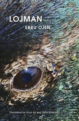 Paperback copy of "Lojman" by City Lights Books, featuring a close-up of the book cover with text and design details.
