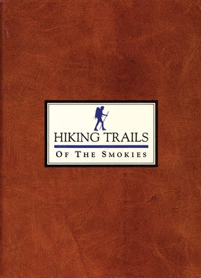Paperback guidebook titled "Hiking Trails of the Smokies" by Great Smoky Mountains Association, showing a scenic mountain trail.