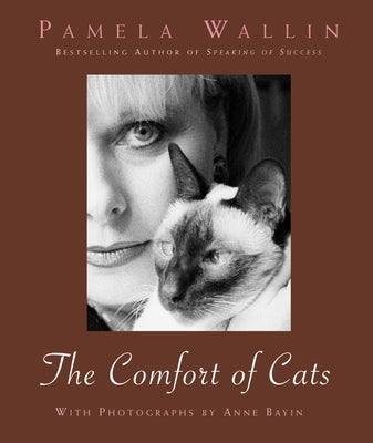 Paperback copy of "The Comfort of Cats" by Prometheus Books featuring a cozy cat-themed cover illustration.