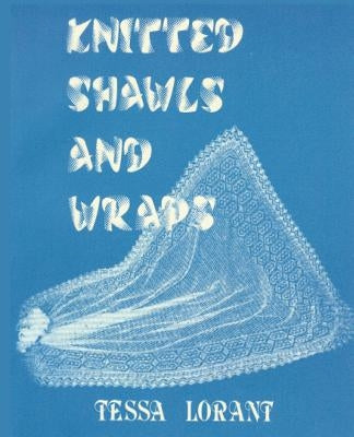 Open paperback of Thorn Press knitted shawls and wraps catalog showing detailed pages and vibrant cover design.